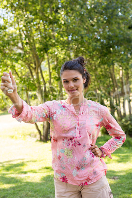 Pretty brunette using her inhaler