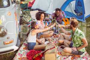 Hipsters having fun in their campsite