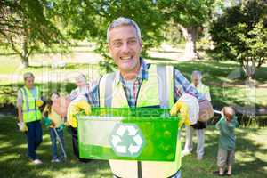 Happy father holding recycling case