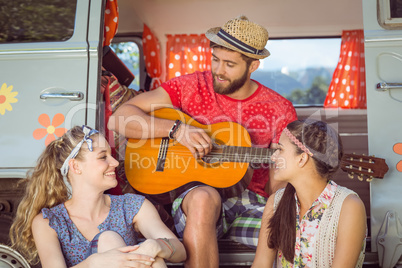 Hipster friends by their camper van