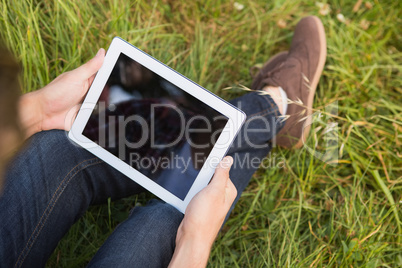 Man with tablet pc in park