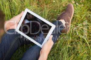 Man with tablet pc in park