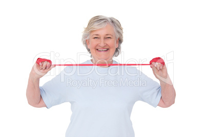 Senior woman using resistance band