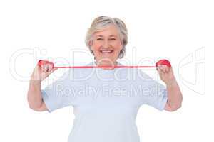 Senior woman using resistance band