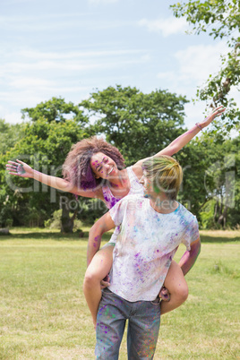 Young friends having fun with powder paint