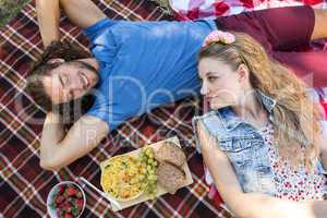 Cute couple having a picnic