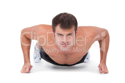 Fit shirtless man doing push ups