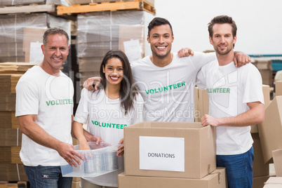 Team of volunteers smiling at camera