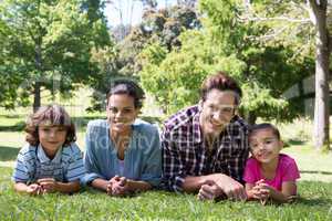 Happy family smiling at camera