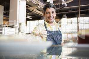 Portrait of a smiling worker in apron