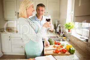Mature couple preparing vegetables together