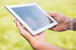 Man with tablet pc in park