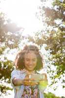 Pretty hipster using her smartphone