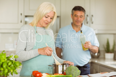 Mature couple making dinner together