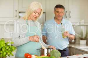 Mature couple making dinner together