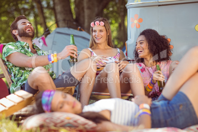 Happy hipsters relaxing on the campsite