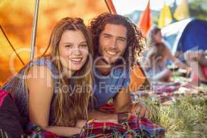 Hipster couple smiling at camera