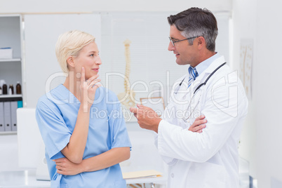 Doctor and nurse discussing in clinic