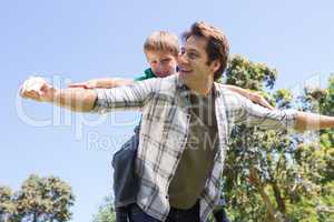 Father and son having fun in the park