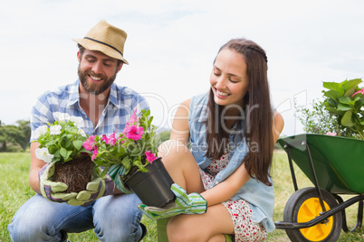 Happy young couple gardening together