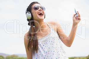 Pretty brunette listening to music