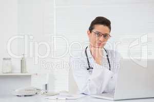 Doctor using laptop