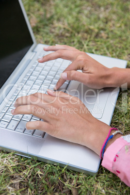 Woman using laptop in park