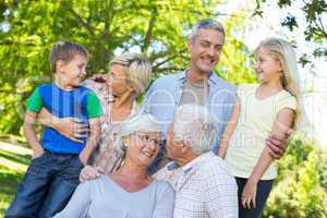 Happy family talking in the park