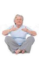 Senior woman doing yoga exercise