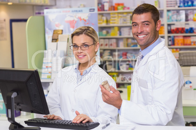 Team of pharmacists looking at camera