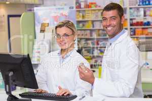 Team of pharmacists looking at camera