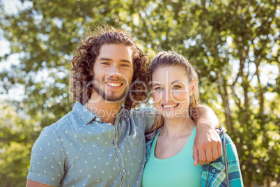 Hipster couple smiling at camera