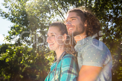 Cute couple smiling and hugging in the park