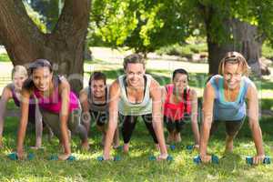 Fitness group planking in park