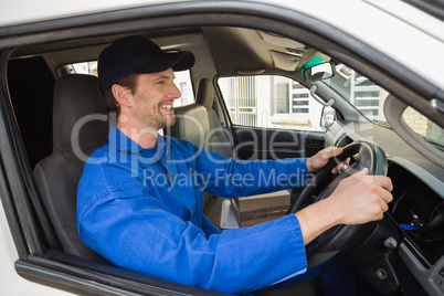 Delivery driver smiling in his van