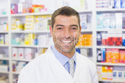 Handsome pharmacist smiling at camera