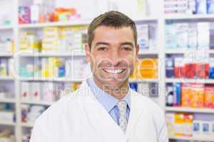 Handsome pharmacist smiling at camera