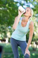 Pretty blonde drinking up water