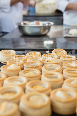 Colleagues making vol-au-vent together