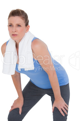 Fit woman with towel on shoulders