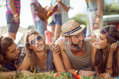 Happy hipsters chatting on the campsite