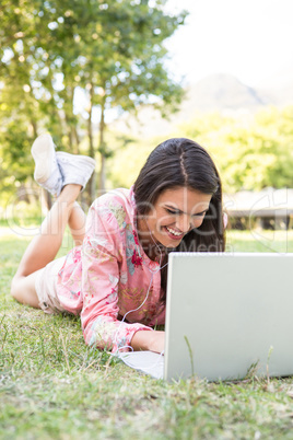 Woman using laptop in park