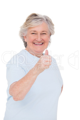 Senior woman showing thumbs up