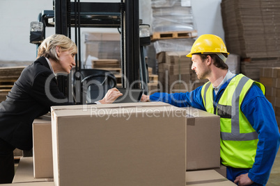 Warehouse worker and manager using tablet pc