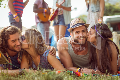Happy hipsters chatting on the campsite