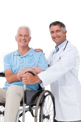 Doctor with senior patient in wheelchair