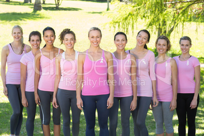 Smiling women in pink for breast cancer awareness