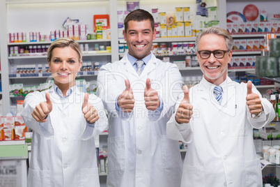 Team of pharmacists smiling at camera