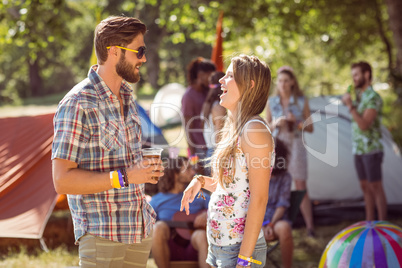 Hipster friends chatting on campsite