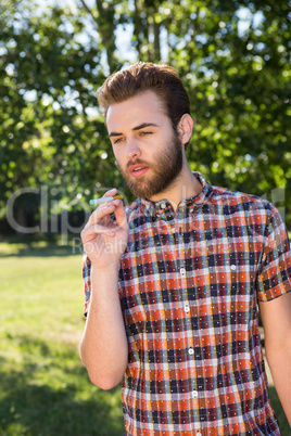 Hipster smoking an electronic cigarette